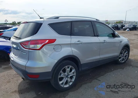 2016 Ford Escape Titanium z USA, uszkodzony, nr VIN 1FMCU0J91GUB70915